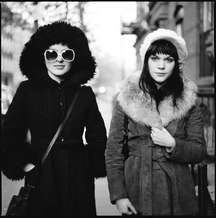 Alex Lee Moyer, waitress and actress (white hat) and Maya Denton, hat check girl and writer, on Bedford Avenue, Williamsburg, Brooklyn